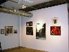 The works are clustered on the walls Salon style.