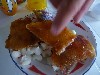 The crisp pig skin is served on boiled hominy