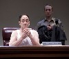 The stripped down judge is shadowed by his alleged lover the baliff (Jim Senti).