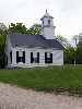 East Washington Baptist Church. The minister is Jack Ward, Frances' son. The church is still heated by two large wood stoves and lit by gas lanterns.