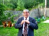 Adjusting his tie outside the Eclipse Mill.