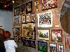 A cluster of collages hung salon style.