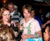 Signing autographs and posing for pictures.