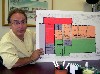 The new artistic director Tony Simotes displays the ground plan for the newly built facilty that houses the Elayne P. Bernstein Theatre.