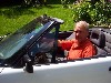 The artist Bruce Koscielniak in his sports car. Hiemer.