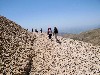 Climbing the rocky path of the tumulus