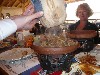 Waitor serving kebab in earthenware pot