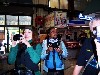 Lyudmila Dakhova, Ukraine, and Padungsak Kochsomrong photographing in a market building.