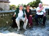 Dirk, Mireille, and Charles resting on a bench in Peiriac.