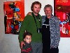Kalman with a Hungarian family, who live in Paraza, posing in front of his paintings.