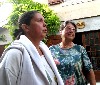 Interacting with Ursula Kara and Johanna van Dijke who have settled in the village.
