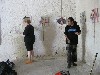 Dorothea and Toi installing the work in the gallery.
