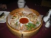 An appetizer of steamed dumplings was large enough to serve a party of four.