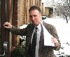 Councilor Michael S. Boland holds the door.