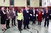 Dick and Michelle saluting the colors surrounded by members of the City Council.