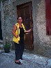Ursula Kara in front of her home.