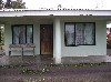 A house with tulle curtains