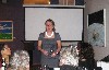 Addressing her guests.