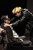 Mr. Sloane (Jack Cutmore-Scott) tries to convince Kemp (Dafydd Rees) to keep his secret.