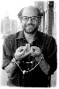 Allen Ginsberg performing a Mudra on his fire escape, NY, 1971.