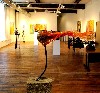 A graceful glass piece stretches out horizontally.