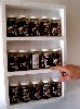 Lachman points out his limited edition of honey as conceptual art works.