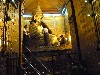 Pilgrims cover Mahamuni Buddha with gold leaf