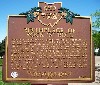 A commemorative sign outside marks the spot.