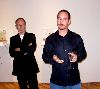 Gallerist Bernard Toale stands behind sculptor Joe Fig.
