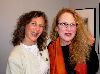 The artists Roberta Paul and Judy Haberl share a joyful moment.