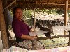 Weaver at traditional loom