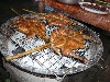 Grilling chicken at the market