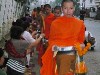 Monks receiving offerings