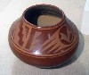 A different firing creates this red pot.