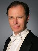Kent Tritle did not appear cramped by an electronic organ as he performed Saint Saens Third  Symphony, called "The Organ."  