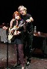 An intimate moment when John helped to tune her guitar.