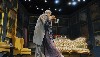 Embracing in a set designed by Alexander Dodge.