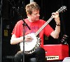 Cline playing banjo.