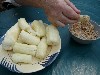 Boiled taro dipped in crushed peanuts