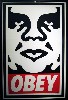 The Shepherd Fairey poster Obey confronts visitors upon entering the gallery.