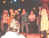 L-R Hayley Reardon, Christine Lavin, Barbara Kessler.
In the rear are audience members conscripted as chorus.