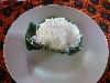 Sticky rice dessert served in banana leaves