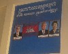 Photos of King and his parents flank Cambodian flag in classroom