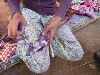 Weaving a basket with palm leaves