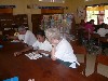 Reading with students in library
