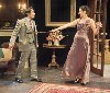 Lady Cynthia uses a tennis racket to fend off a mysterious stranger.