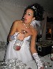 The bride mixing drinks.