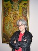 Katherine French of the Danforth Museum in front of a painting by Bloom.