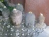 Buddha heads graced with frangipani