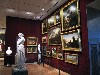 A gallery of works hung Salon Style.
